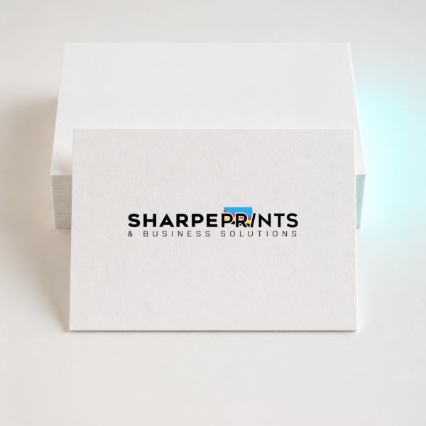 Stack of premium Sharpe Prints business cards on a clean studio background